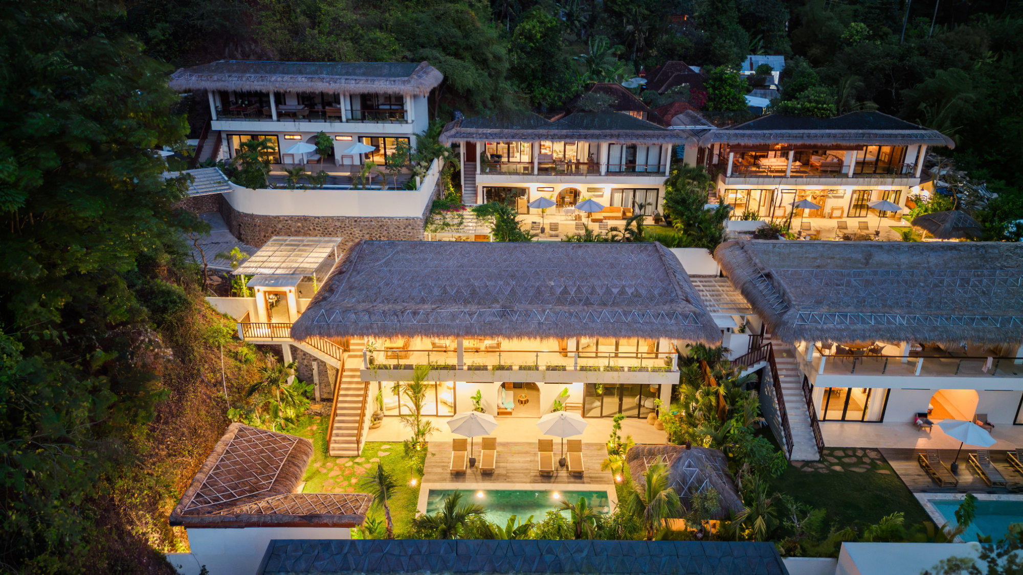 Drone view at night of the Vesica Villas Resort in Amed East Bali.