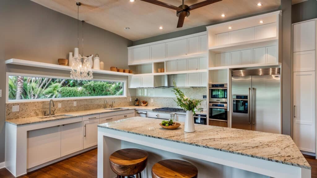 Kitchen with marble top island and wooden floors