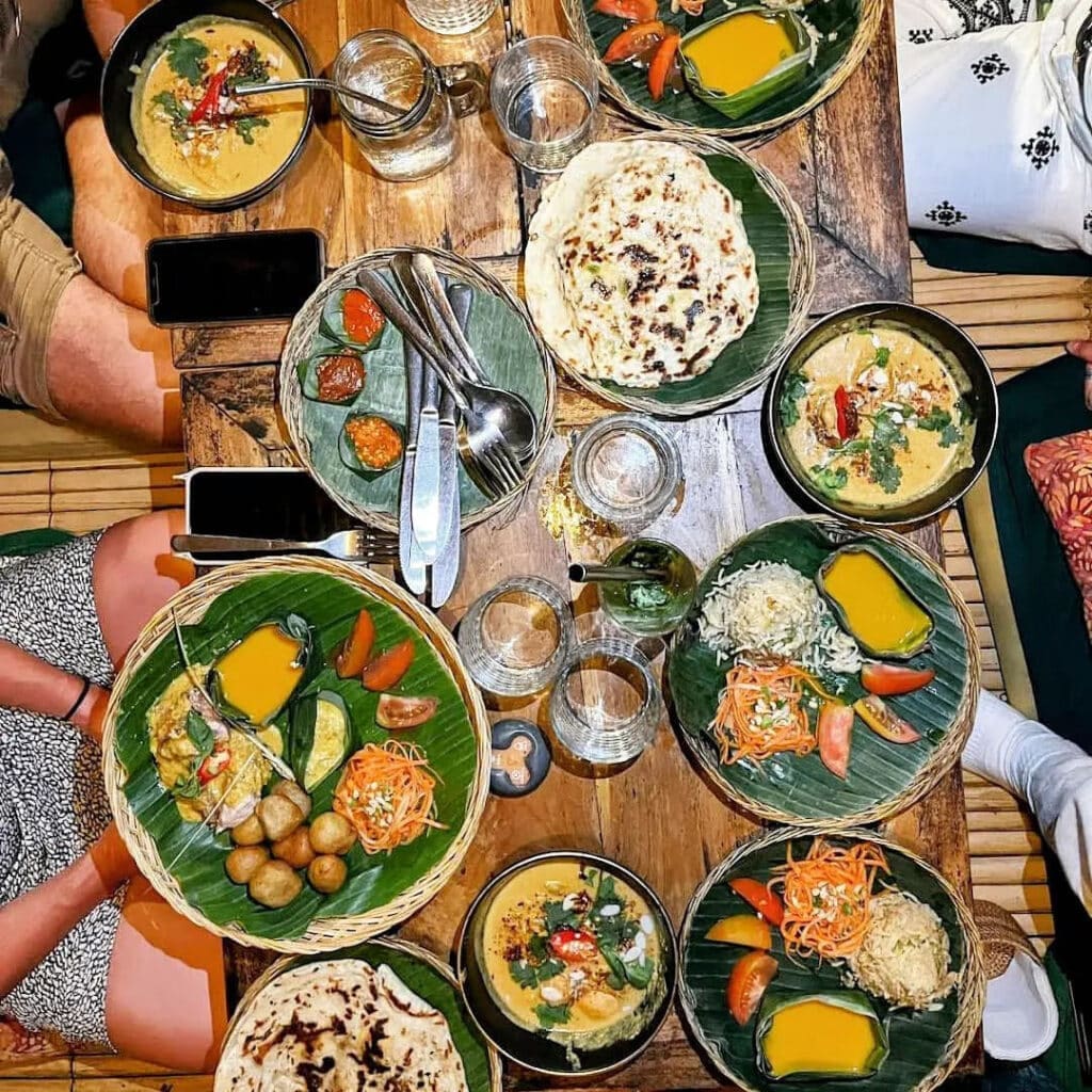 Table of Asian and Balinese food served at Galanga Restaurant on Amed Beach on Bali.