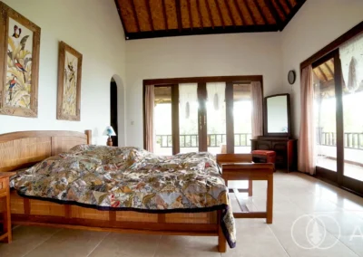 Solid bedroom furniture in Balinese style house with access to ensuite bathroom