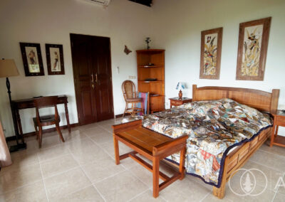 Solid bedroom furniture in Balinese style house with access to ensuite bathroom