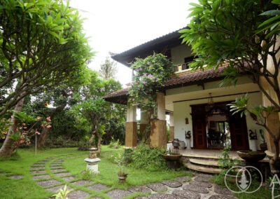 Doorway entrance to Balinese villa in Amed set in a lush tropical garden