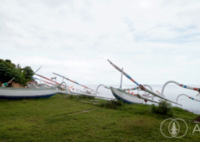 Traditional Balinese boats at rest on the beach in Amed.