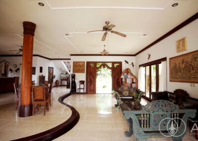 Living room on the lower floor of a large villa for sale in Amed Bali.