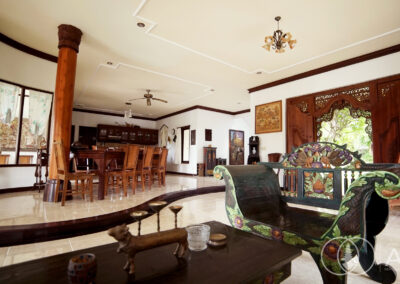 Colourful Balinese wooden furniture in a large villa for sale in Amed.