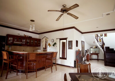 Living space in Balinese villa with a bar area made with wood