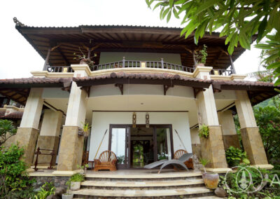 Front view of a 5-bedroom Balinese style villa on beachfront land in Amed, Bali.