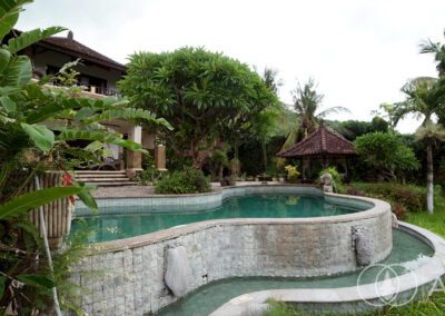 Swimming pool set in the garden of a beachfront villa in Amed