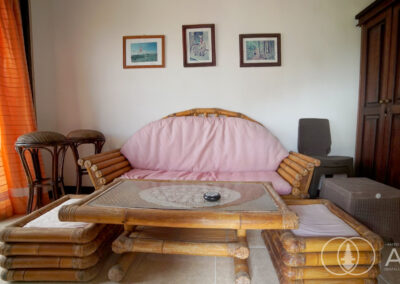 Bamboo sofa and table with teak wooden wardrobe in a private reading room