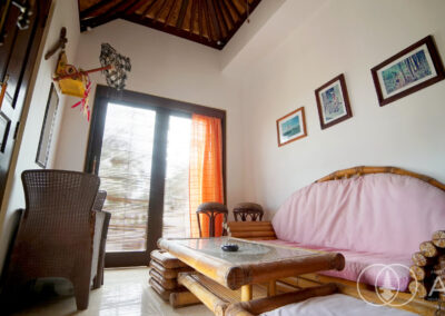 Reading room with bamboo furniture in a Balinese villa in Amed.