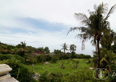 Elevated garden and ocean view of a beachfront villa in Amed, Bali.