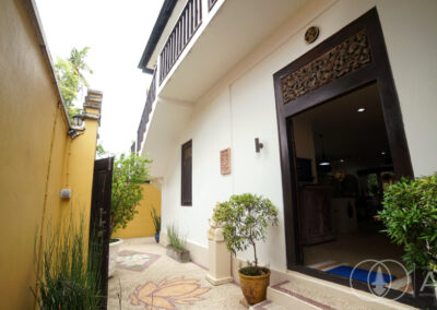 Balinese Wooden door frame of entrance to a beach front house in Amed.