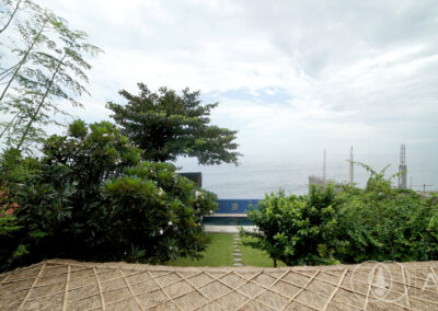 View of the Bali Sea looking down the garden from the 2nd Floor of a beachfront house in Amed